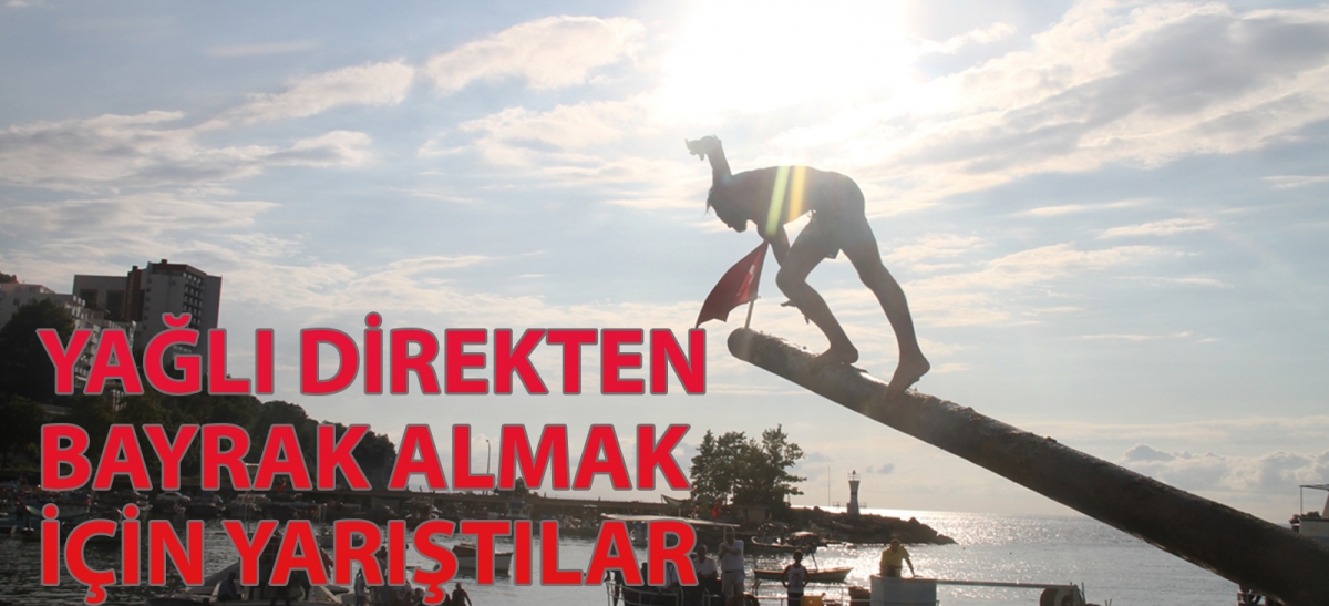 Yağlı direkten bayrak almak için yarıştılar