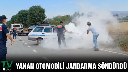 Yanan otomobili jandarma söndürdü