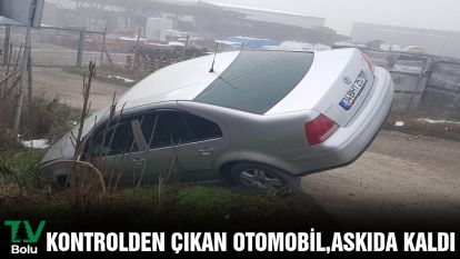  Kontrolden çıkan otomobil, askıda kaldı