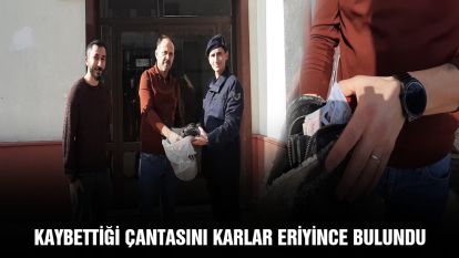 Kaybettiği çantasını karlar eriyince buldu