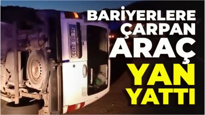Bariyerlere çarpan araç yan yattı