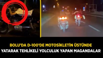 Bolu'da D-100'de motosikletin üstünde yatarak tehlikeli yolculuk yapan magandalar kamerada
