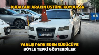 Yanlış park eden sürücüye böyle tepki gösterdiler.... Dubaları aracın üstüne koydular