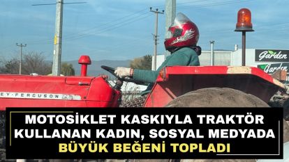 Motosiklet kaskıyla traktör kullanan kadın, sosyal medyada büyük beğeni topladı